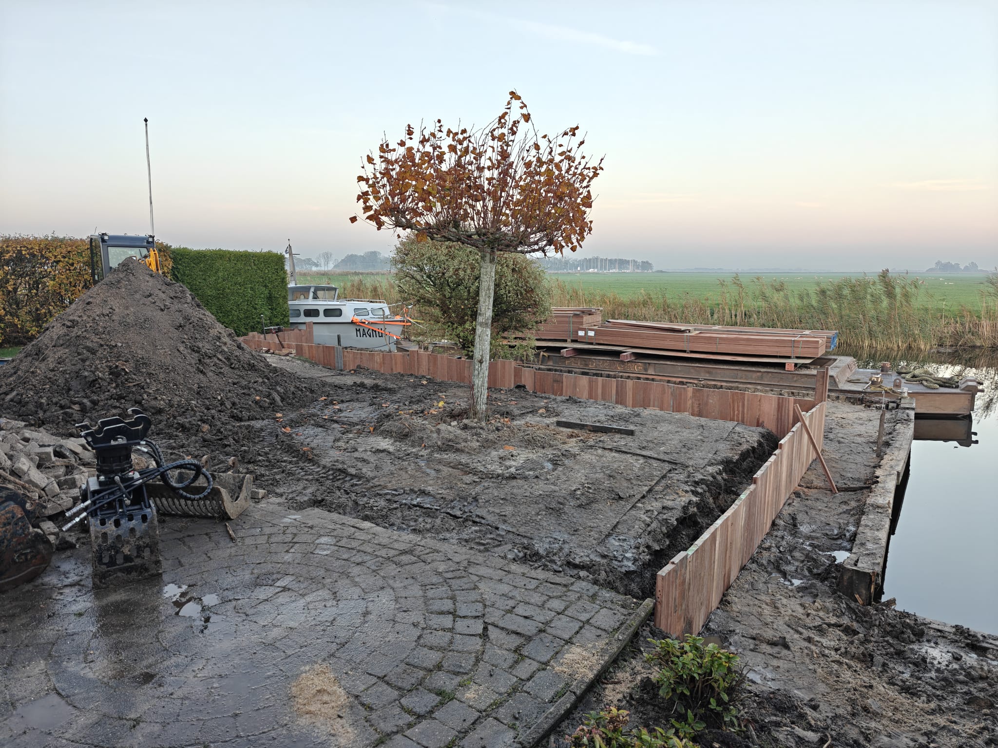Tuinaanleg bij woning aan het water — foto 4