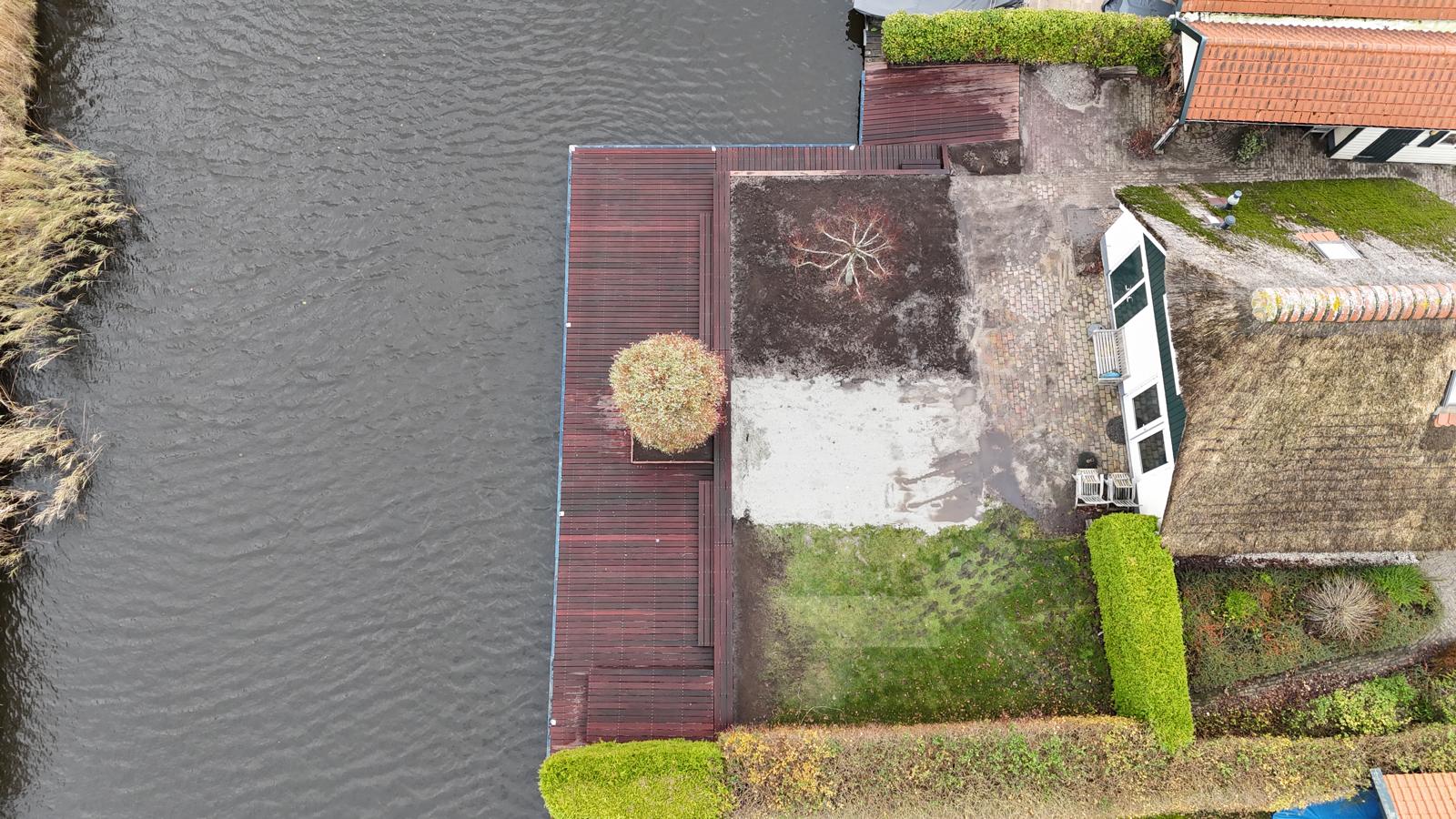 Tuinaanleg bij woning aan het water — foto 6