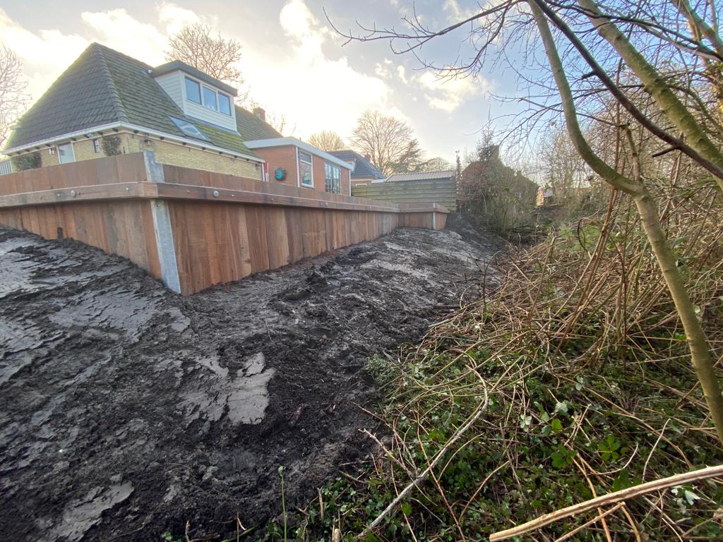 Tuinaanleg bij woning aan het water — foto 12